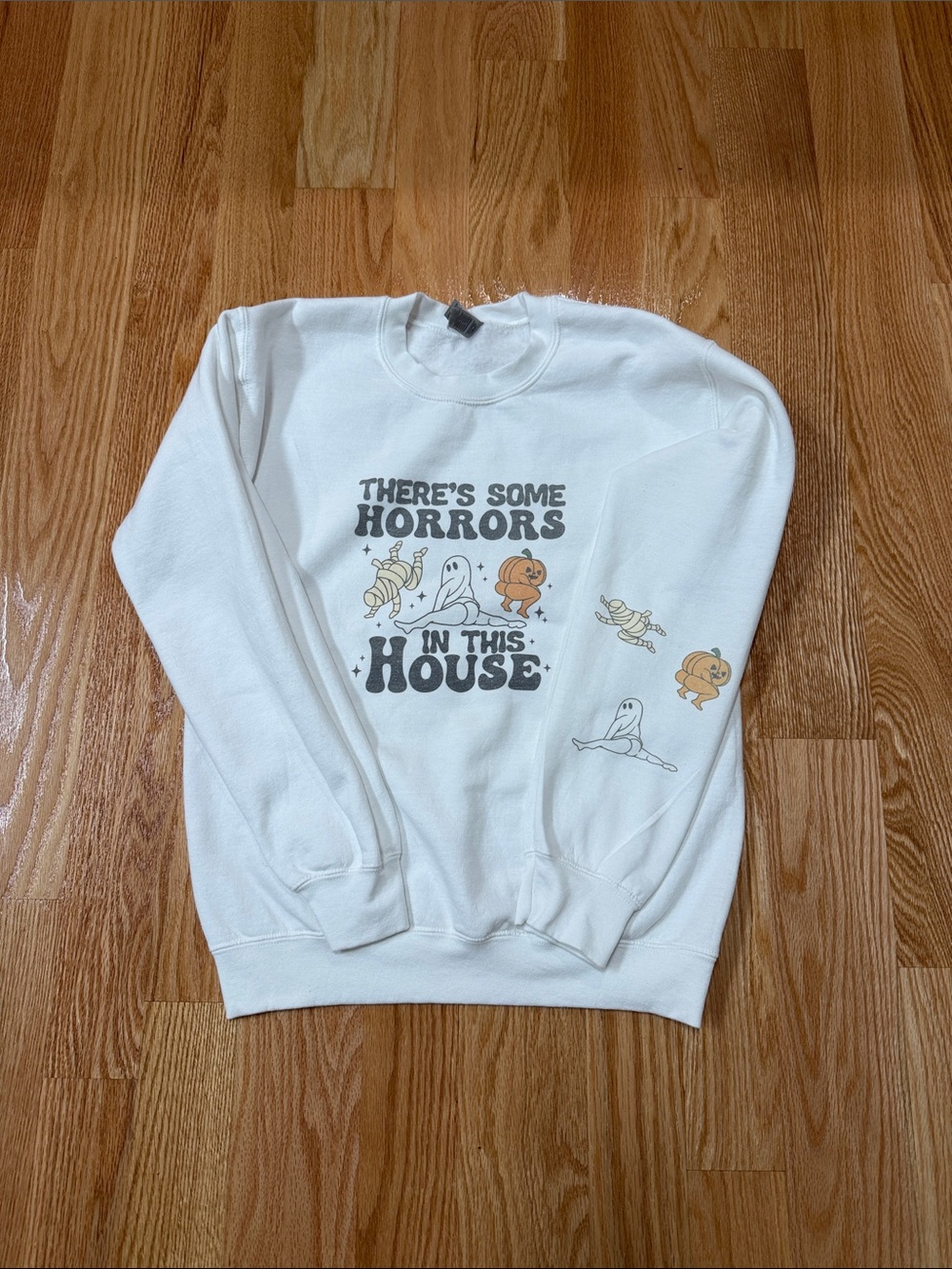 White Graphic Crewneck Sweatshirt - 'There's Some Horrors In This House'- Size S